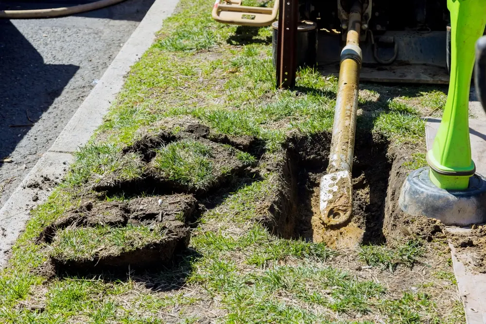 Machine-performs-trenchless-drain-cleaning-on-grass